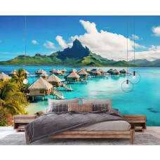 Eine Fototapete von einer paradiesischen Insel mit einem Strand und türkisfarbenem Meer, ideal für ein Schlafzimmer.