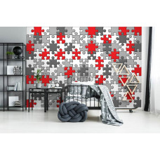 Eine Fototapete mit einem farbenfrohen Puzzlemuster, das ein Babyzimmer verschönert.