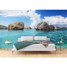 Eine Fototapete von Felsen im Meer, blau für Schlafzimmer.