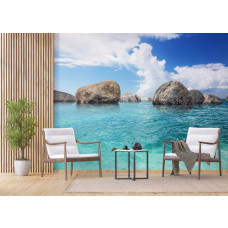 Eine Fototapete von Felsen im Meer, blau für Wohnzimmer.