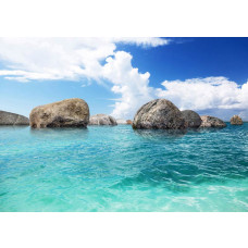 Eine Fototapete von Felsen im Meer, blau.