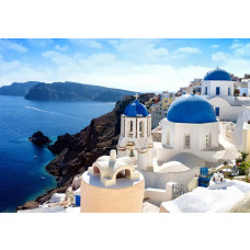 Fototapete von Santorin in Griechenland, mit einem Urlaubslook und blauen Dächern.