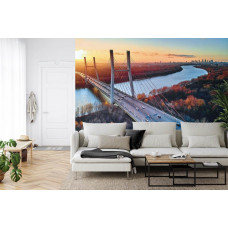 Eine Fototapete mit der Siekierkowski-Brücke vor einem Stadthintergrund, abgebildet in einem Wohnzimmer.