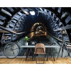 Eine Fototapete mit einem spannenden Tunnel mit Kohle und Gleisen, perfekt für das Wohnzimmer.