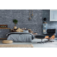 Eine Fototapete mit einer anthrazitfarbenen Ziegelwand in einem schlichten Design, ideal für ein Schlafzimmer.