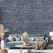 Eine Fototapete mit einer anthrazitfarbenen Ziegelwand in einem schlichten Design, geeignet für ein Wohnzimmer.