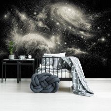 Eine Fototapete mit Sternen und Planeten in einem farbenfrohen Kosmos, speziell für ein Babyzimmer entworfen.