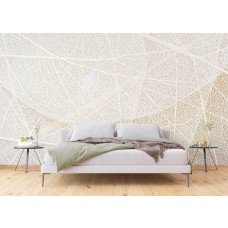 Eine Fototapete mit der Struktur von Blättern in einem Schlafzimmer.
