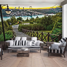 Fototapete mit Blick auf eine Stadt und Brücke in einer natürlichen Landschaft, geeignet für das Wohnzimmer.