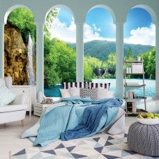 Eine Fototapete mit 3D-Blick auf einen Wasserfall mit Säulen, perfekt für ein Schlafzimmer.