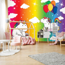 Eine Fototapete mit einem Einhorn und Regenbogen für das Babyzimmer.