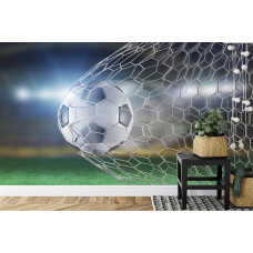 Eine Fototapete mit einem beeindruckenden Torschuss aus einem Fußballspiel in einem Kinderzimmer.
