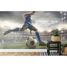 Eine Fototapete, die einen Fußballer in Aktion in einem Stadion in einem Kinderzimmer zeigt.