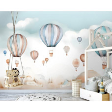 Eine Fototapete mit fröhlichen Heißluftballons für Kinder in einem Kinderzimmer.