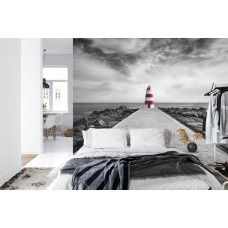 Ein Fototapete mit einem Leuchtturm an einem Strand in Praia da Rocha, Algarve, perfekt für ein Schlafzimmer.