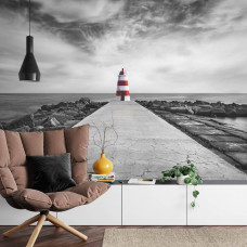 Ein Fototapete mit einem malerischen Leuchtturm an der Küste der Algarve, ideal für ein Wohnzimmer.