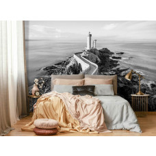 Eine Fototapete mit einem Leuchtturm am Meer mit einer Landschaft für das Schlafzimmer.
