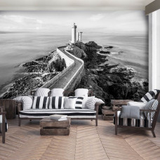 Eine Fototapete mit einem Leuchtturm am Meer mit einer Landschaft für das Wohnzimmer.