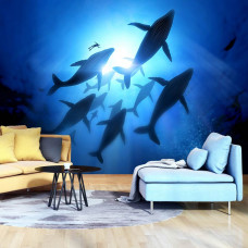 Eine Fototapete mit Walen im Meer für das Wohnzimmer.