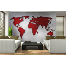 Eine Fototapete mit einer abstrakten Weltkarte auf einer Betonwand in Rot und Grau.