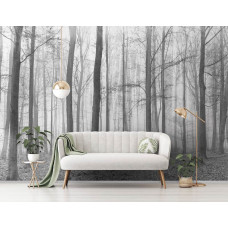 Eine Fototapete von einem Winterwald mit Bäumen im Schlafzimmer gesehen.