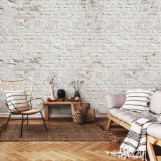 Eine Fototapete mit einer weißen Ziegelwand im Industriedesign, geeignet für ein Wohnzimmer.