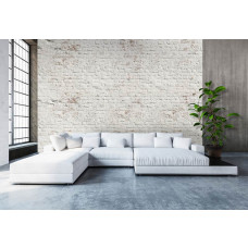 Eine Fototapete mit einer weißen Ziegelwand im Industriedesign, perfekt für ein Wohnzimmer.