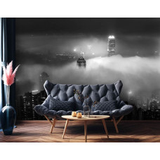 Eine Fototapete mit Wolkenkratzern in der Nacht in New York, mit Wolken im Wohnraum.