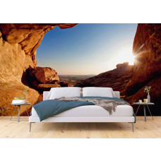 Eine 3D-Fototapete eines Sonnenuntergangs aus einer Höhle in einem Schlafzimmer.