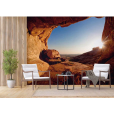 Eine 3D-Fototapete eines Sonnenuntergangs aus einer Höhle in einem Wohnzimmer.