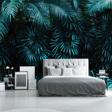 Eine Fototapete von Dschungelblättern in einem Dschungelzimmer für das Schlafzimmer.