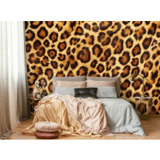 Eine Fototapete mit Leopardenmuster, perfekt für ein Schlafzimmer.