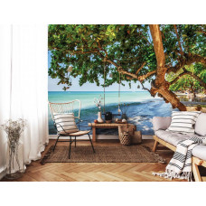 Fototapete Strand mit einer Baumschaukel am Meer.