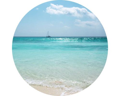 Horizont am Meer mit einem Sonnenuntergang auf einem exotischen Wandkreis.