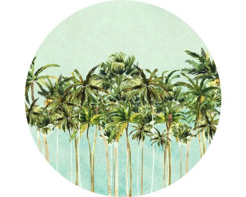 Tropische Palmen in einer exotischen Landschaft auf einem Wandkreis.