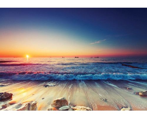 Strandtapete mit Sonnenuntergang am Meer, Fototapete mit warmen Tönen.