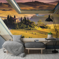 Eine Fototapete mit einer Landschaft und Blick durch ein Dachfenster, ideal für das Schlafzimmer und das Wohnzimmer.