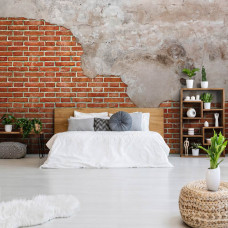 Eine industrielle Fototapete von einer roten Ziegelwand mit Betonelementen im Schlafzimmer.