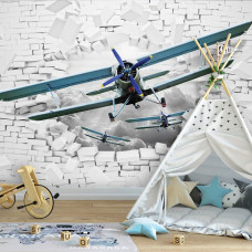 Eine Fototapete mit Flugzeugen durch eine Ziegelwand mit 3D-Effekten für das Babyzimmer.