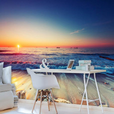 Eine Fototapete mit Strand bei Sonnenuntergang am Meer für das Büro.