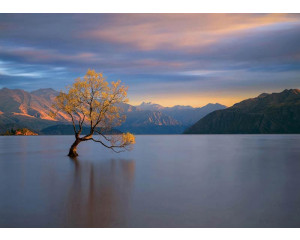 Fototapete Magischer Sonnenuntergang am Bergmeer