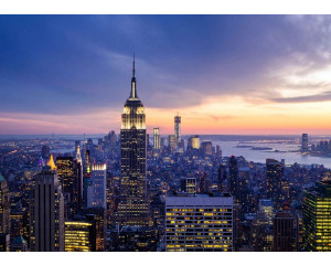 Fototapete mit einem Sonnenuntergang über der New Yorker Skyline.
