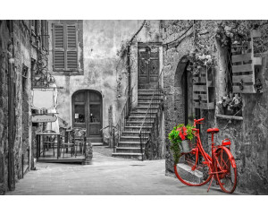 Eine Gasse in der Toskana, Italien, mit malerischen Straßen und historischer Architektur, abgebildet auf einer Fototapete.